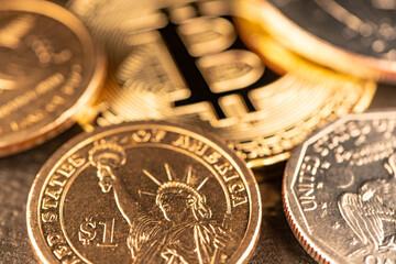 One US Dollar coin with Gold Bitcoin out of Focus. Digital Crypto Currency trading to USD.