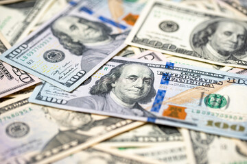 Closeup of one hundred dollar banknotes, new and old paper bills from USA. American cash and money piled up