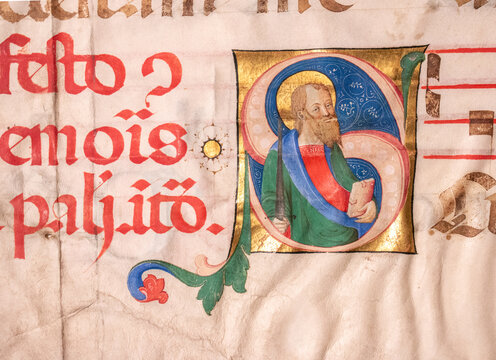 Illuminated historiated initial showing a Florentine painting of St Paul, the Apostle. Painted in about 1480 on a full vellum leaf for an Antiphonal with music on staves. 