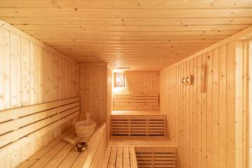 Obraz na płótnie Canvas Small home wooden sauna, spa room. Relax in a hot sauna.