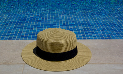 Fototapeta na wymiar hat on the swimming pool in a resort