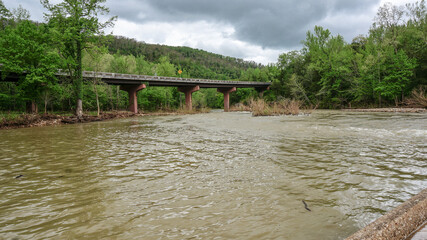 highway bridge over flooded Buffalo River in Jasper, Arkansas