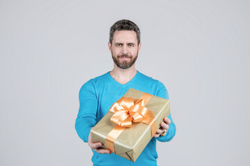 sale and discount. surprise for her. valentines day. boxing day. handsome man giving present box.