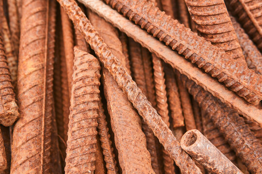 pieces of rusty rebar piled in a heap close-up