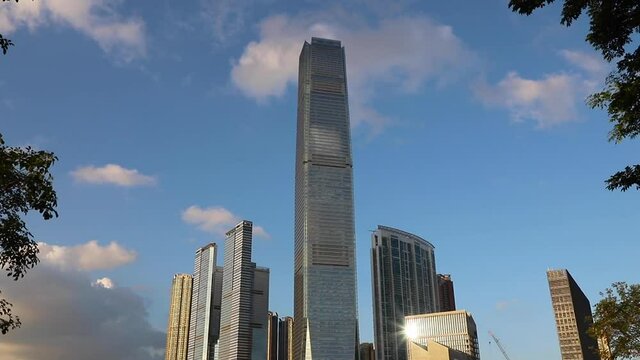 Cityscape Of  Buildings Near West Kowloon Waterfront Promenade, Hong Kong, With Blue Sky, White Clouds In Background