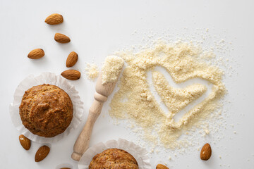 gluten free baked goods, muffins on almond flour with nuts on a white background, love heart...