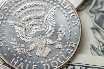 Half Dollar coin on Dollar Banknotes. Closeup of 50 cents, Half Dollar silver coin