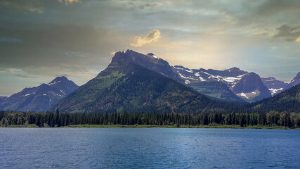 a beautiful lake in front of the mountains in canada