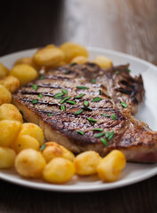 Grilled Beefsteak with Baby Roasted Potatoes. High quality photo.