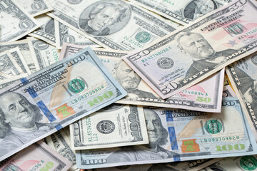 Dollar Banknotes as Background, distributed USD. banknotes from one to one hundred Dollar Bills. Cash piled up