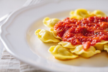 Ravioli with tomato sauce. Typical italian dish.