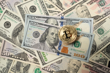 Bitcoin Crypto currency with US dollar banknotes. Crypto coins and 100 dollar bills. Digital currency on top of fiat money - obrazy, fototapety, plakaty