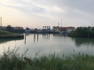 boats in the harbor in Caorle, Italy