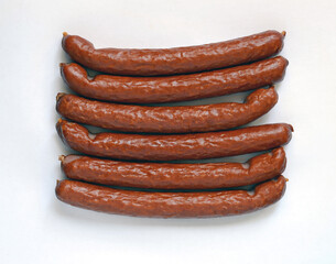 Long Smoked sausages on a white background.
