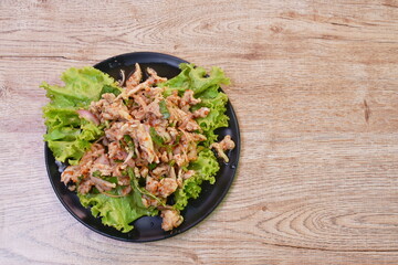 Thai spicy chop chicken salad and fresh vegetable on plate