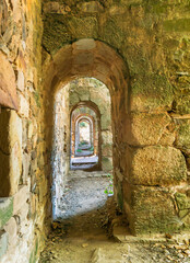 Fototapeta na wymiar Exterior stone passageway in the 12th century Cistercian Monastery of Santa María de Moreruela, in Zamora. Spain. Europe.