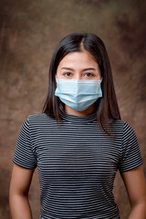 A female model wearing a mask to prevent a plague.