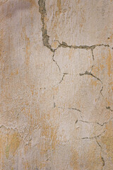 Gray plastered concrete wall with cracks.  Industrial building. Grunge. Is an excellent choice for your design and texture background. Space for text.
