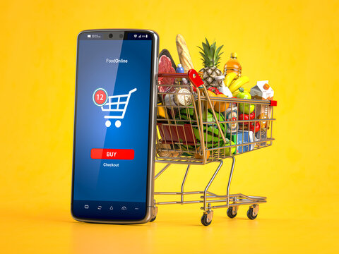 Shopping Cart Full Of  Food And Smartphone. Grocery Market Shop, Food And Eats Online Ordering, Buying And Delivery Concept.