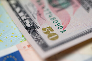 Fifty dollar banknote, closeup view of US dollar and euro bill. Gold 50 writing on USD paper money