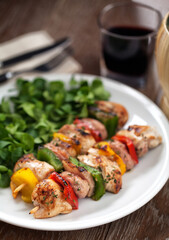 Chicken skewers with side salad. High quality photo.