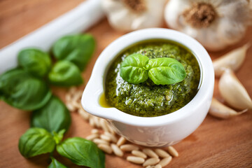 Pestle and ingredients for pesto sauce. High quality photo.