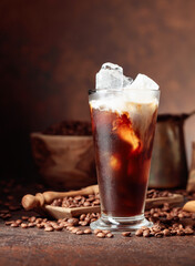 Ice coffee with cream in frozen glass.