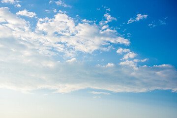 Fototapeta premium Blue sky and white clouds, the freshness of the new day. The bright blue background gives a feeling of relaxation as in the sky, the scenery of the blue sky and the light of the sun.