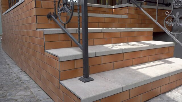 brown stairs to the house,beautiful stairs after construction to the outside of the house with railings