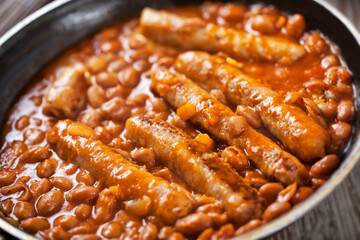 Sausage and Beans with Tomato Sauce on a pan.