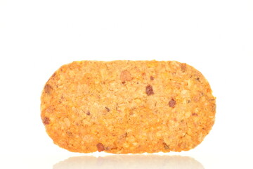 One cookie with pieces of fruit, close-up, isolated on white.