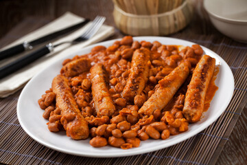 Sausage and Beans with Tomato Sauce on a plate.