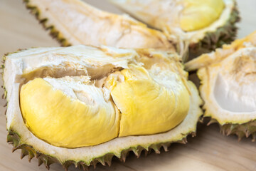 Durian riped and fresh ,durian peel with yellow colour on wooden table.