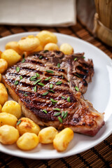 Grilled Beefsteak with Baby Roasted Potatoes. High quality photo.