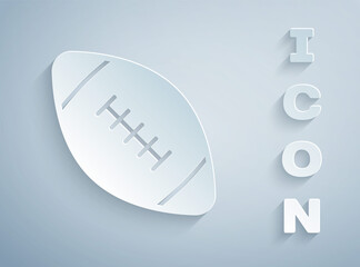 Paper cut American football ball icon isolated on grey background. Rugby ball icon. Team sport game symbol. Paper art style. Vector