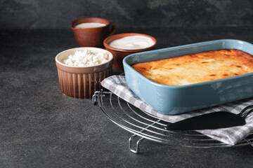 Dish with tasty cottage cheese casserole on table