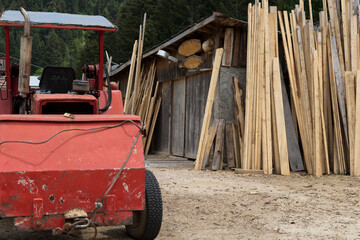 Fototapeta na wymiar Ready timber and construction equipment at the lumberjack.