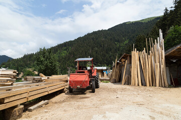 Ready timber and construction equipment at the lumberjack.