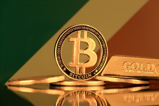 Physical version of Bitcoin, gold bar and Congo Republic Flag.