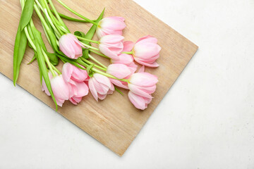 Obraz na płótnie Canvas Beautiful tulip flowers on light background