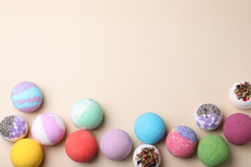 Colorful bath bombs on light background, flat lay. Space for text