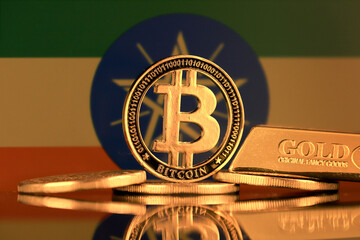Physical version of Bitcoin, gold bar and Ethiopia Flag.