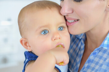 Portrait of mother holding baby