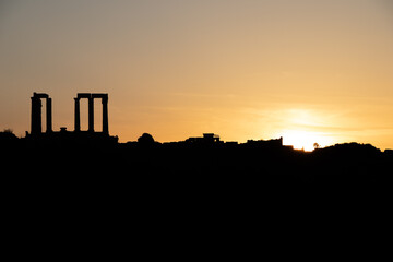 Sunset at Sounion Cape with the silhouette of Poseidon Temple