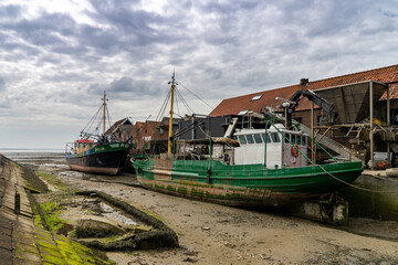 fishing boats in the port of Yerseke at low tide