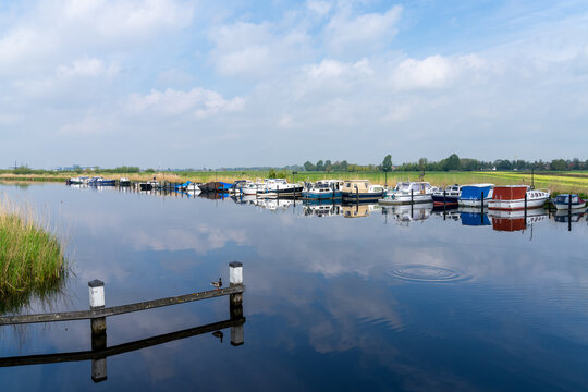 colorful boats moored in the canals of South Holland