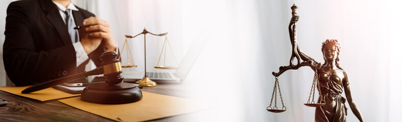 Business and lawyers discussing contract papers with brass scale on desk in office. Law, legal services, advice, justice and law concept picture with film grain effect