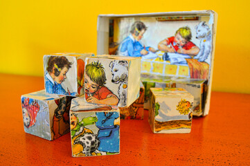 Vintage toy, block puzzle with multiple prints