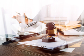 Business and lawyers discussing contract papers with brass scale on desk in office. Law, legal services, advice, justice and law concept picture with film grain effect