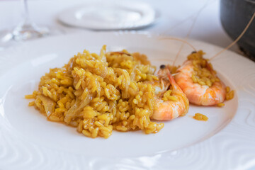 Close up of a plate of delicious rice with shrimps: Selective focus traditional food concept.